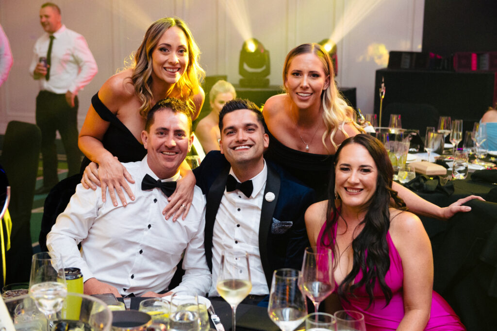 People are posing for a photo at Boobalicious Ball 2024