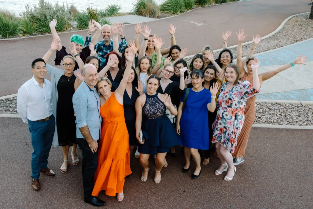 Staff at prosper health collective posing for a group photo at the 10 year anniversary party